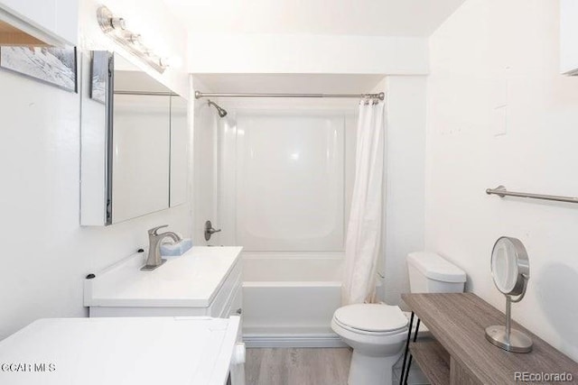 62927 US Highway 40 Unit 127, Granby, CO 80446 - bathroom featuring vanity, shower / tub combo with curtain, and wood finished floors