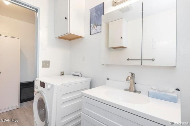 62927 US Highway 40 Unit 127, Granby, CO 80446 - washroom with washer / dryer and light wood-style flooring