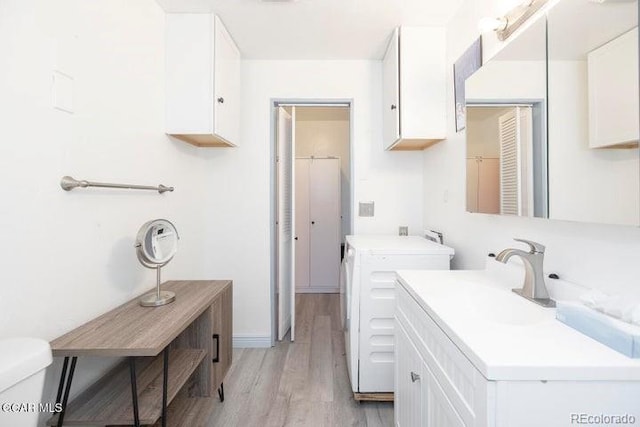 62927 US Highway 40 Unit 127, Granby, CO 80446 - washroom featuring washer and dryer and light wood finished floors