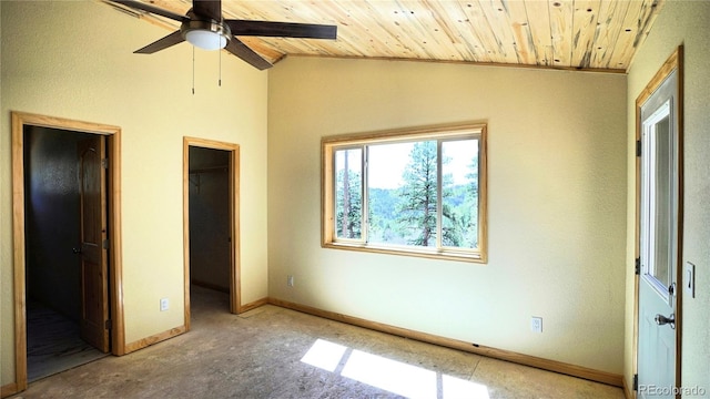 325 Bob Cat Trl, Bailey, CO 80421 - unfurnished bedroom featuring a walk in closet, wood ceiling, lofted ceiling, baseboards, and a closet