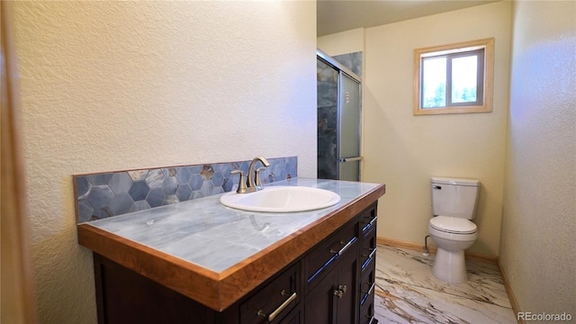 325 Bob Cat Trl, Bailey, CO 80421 - full bathroom with vanity, marble finish floors, a shower with door, toilet, and a textured wall