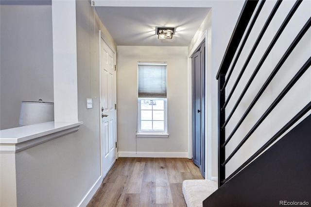 doorway with light hardwood / wood-style floors