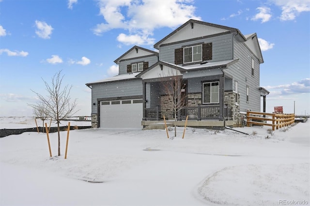 view of front of property featuring a porch and a garage