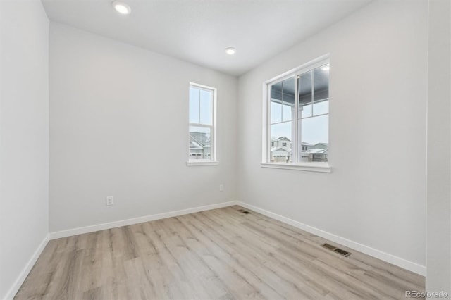 empty room featuring light hardwood / wood-style floors