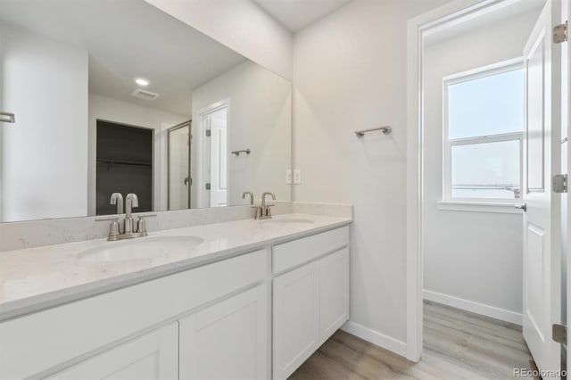 bathroom with vanity and hardwood / wood-style floors