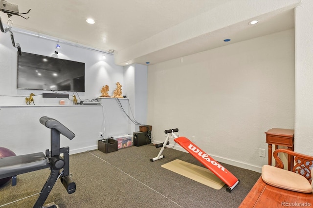 exercise room with recessed lighting and baseboards