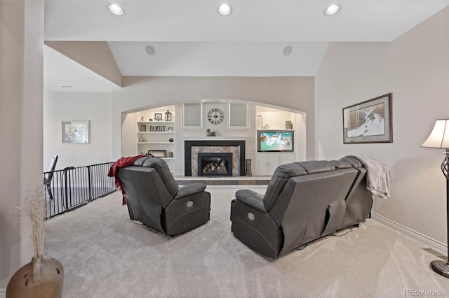 living room with carpet floors, recessed lighting, baseboards, and a fireplace