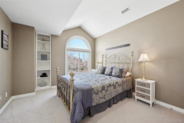 carpeted bedroom featuring baseboards, visible vents, and vaulted ceiling