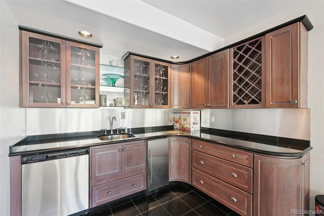 bar with indoor wet bar, dark tile patterned floors, recessed lighting, a sink, and appliances with stainless steel finishes