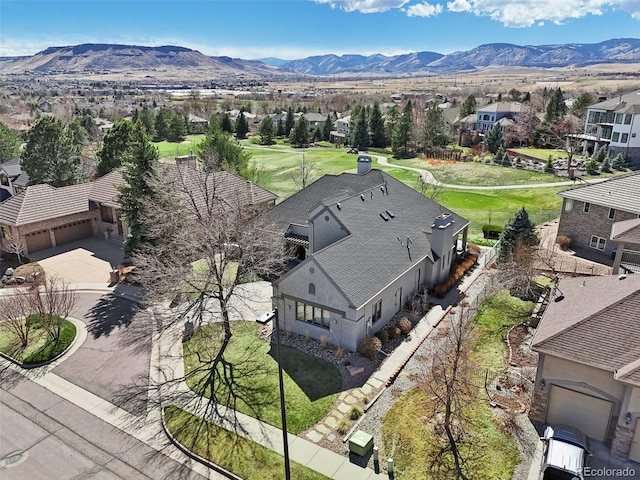 birds eye view of property with a residential view and a mountain view