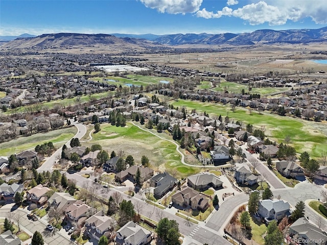 bird's eye view featuring a mountain view, golf course view, and a residential view
