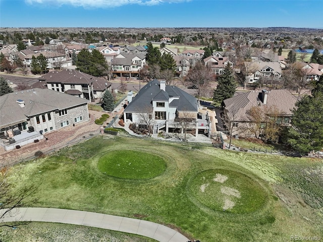 aerial view featuring view of golf course and a residential view