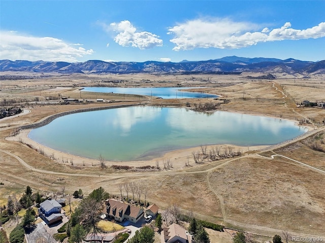 bird's eye view with a water and mountain view