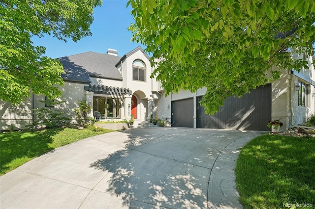 7081 Salvia St, Arvada, CO 80007 - view of front of house featuring a garage, stucco siding, driveway, and a pergola