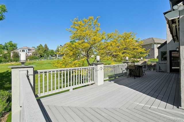 7081 Salvia St, Arvada, CO 80007 - wooden terrace with a yard, outdoor dining area, and a residential view