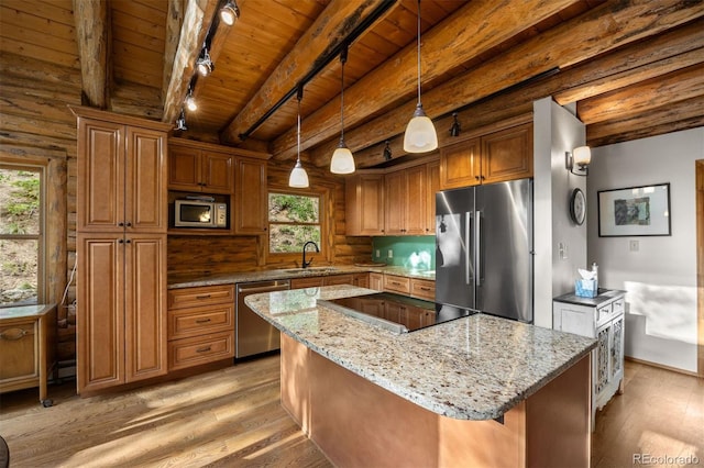80 Spruce Ct, Evergreen, CO 80439 - kitchen featuring appliances with stainless steel finishes, a wooden ceiling with exposed beams, light wood finished floors, light stone countertops, and brown cabinets