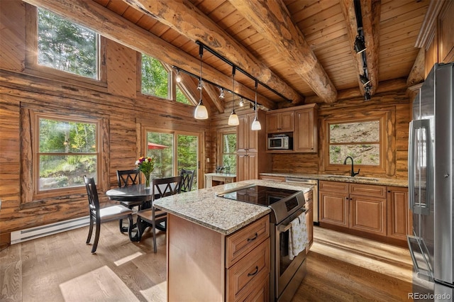 80 Spruce Ct, Evergreen, CO 80439 - kitchen featuring appliances with stainless steel finishes, track lighting, wooden ceiling, light wood finished floors, and light stone countertops