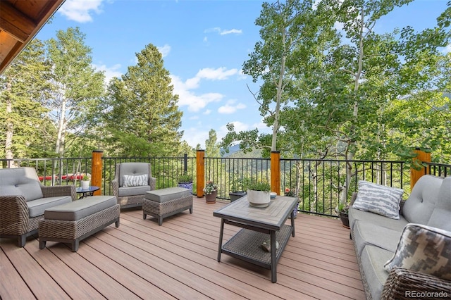80 Spruce Ct, Evergreen, CO 80439 - wooden deck featuring outdoor lounge area