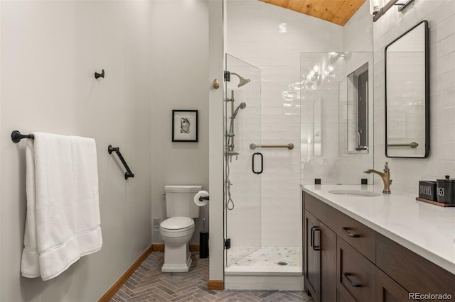 80 Spruce Ct, Evergreen, CO 80439 - bathroom with lofted ceiling, a shower stall, double vanity, wood ceiling, and brick patterned floors