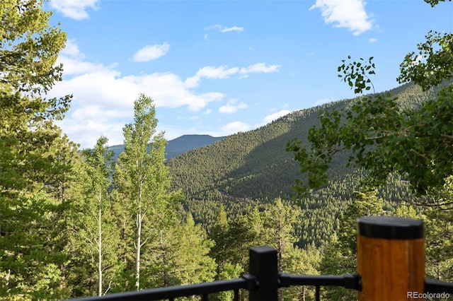 80 Spruce Ct, Evergreen, CO 80439 - view of mountain backdrop featuring a heavily wooded area