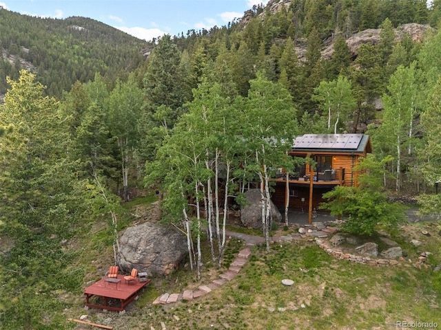80 Spruce Ct, Evergreen, CO 80439 - view of yard with a wooded view and a deck with mountain view