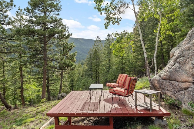 80 Spruce Ct, Evergreen, CO 80439 - deck featuring a wooded view and a mountain view