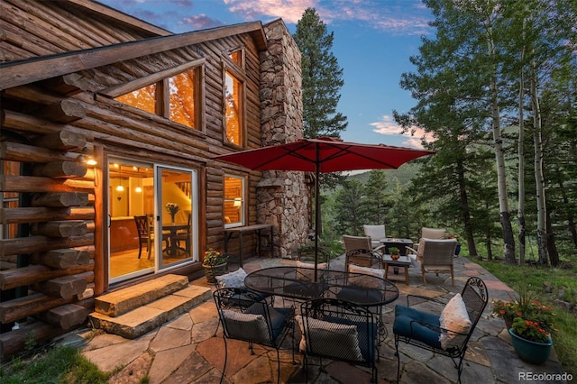 80 Spruce Ct, Evergreen, CO 80439 - view of patio / terrace with outdoor dining space and entry steps