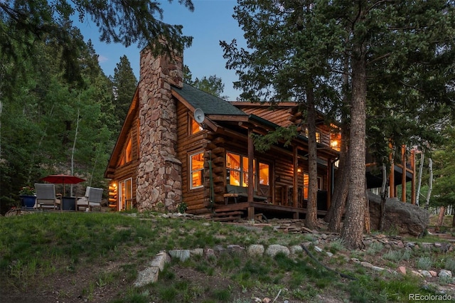 80 Spruce Ct, Evergreen, CO 80439 - view of side of property featuring log exterior and a chimney