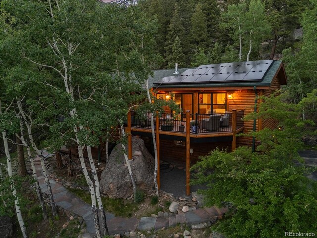 80 Spruce Ct, Evergreen, CO 80439 - rear view of property with a wooden deck, a wooded view, and log veneer siding