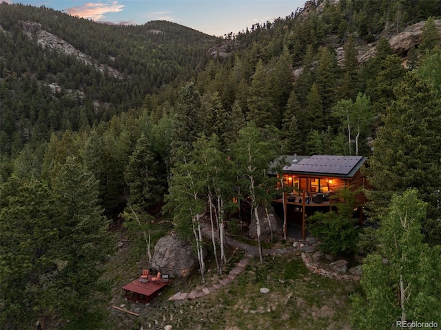 80 Spruce Ct, Evergreen, CO 80439 - view of mountain backdrop featuring a heavily wooded area
