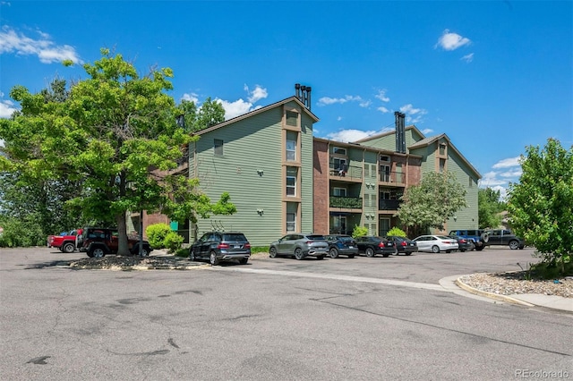 4899 S Dudley St Unit 7E, Littleton, CO 80123 - view of building exterior with uncovered parking