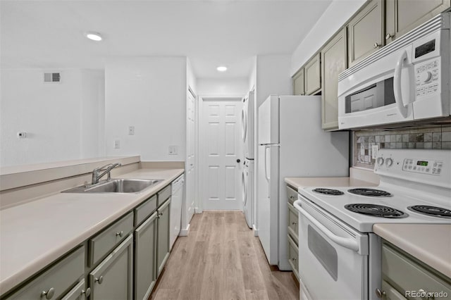 4899 S Dudley St Unit 7E, Littleton, CO 80123 - kitchen with white appliances, light wood-style flooring, light countertops, recessed lighting, and gray cabinets