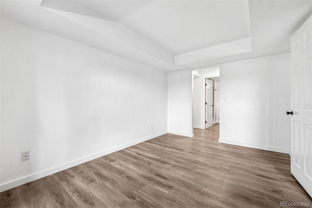 4899 S Dudley St Unit 7E, Littleton, CO 80123 - unfurnished room with a raised ceiling and wood finished floors