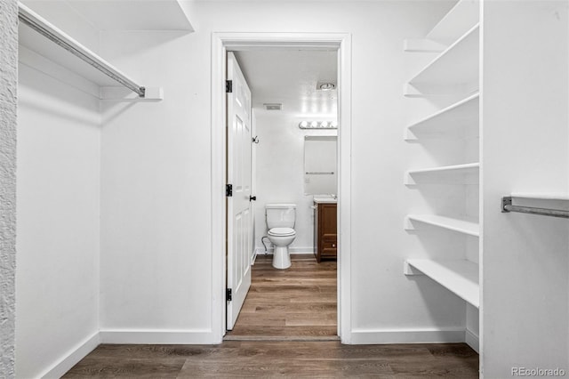 4899 S Dudley St Unit 7E, Littleton, CO 80123 - spacious closet featuring wood finished floors