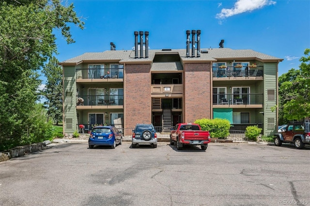 4899 S Dudley St Unit 7E, Littleton, CO 80123 - view of apartment building / complex with uncovered parking