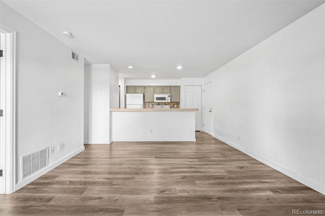 4899 S Dudley St Unit 7E, Littleton, CO 80123 - unfurnished living room featuring recessed lighting and wood finished floors