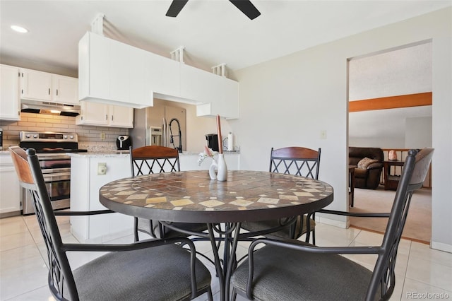dining space featuring a ceiling fan, light tile patterned floors, and recessed lighting