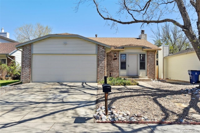 ranch-style house featuring an attached garage, concrete driveway, brick siding, and a chimney