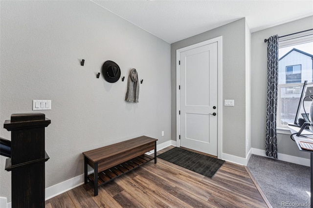 entryway with dark hardwood / wood-style flooring