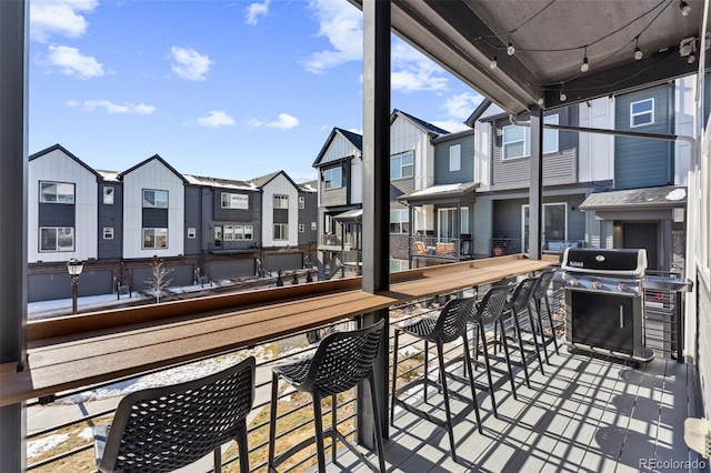 deck featuring area for grilling and an outdoor bar