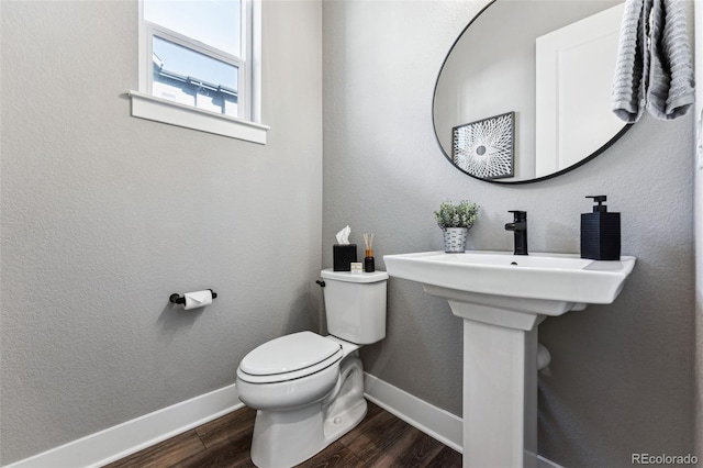 bathroom featuring toilet and hardwood / wood-style floors