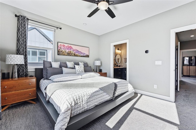 carpeted bedroom with ceiling fan and ensuite bath