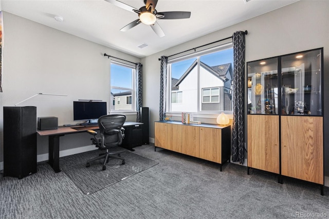 office with ceiling fan and dark colored carpet