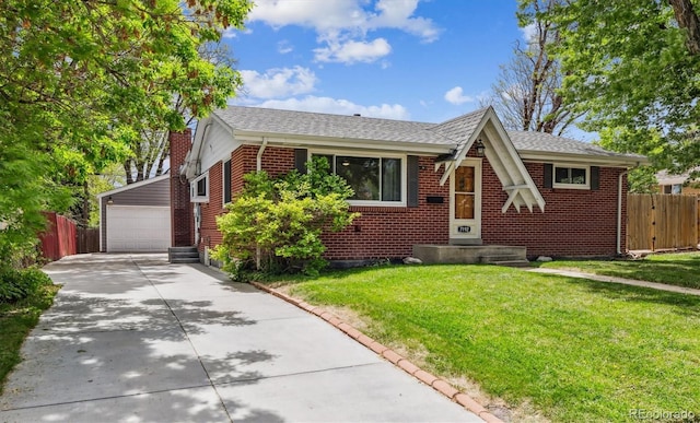 7192 W 67th Pl, Arvada, CO 80003 - tudor house featuring a garage, brick siding, an outbuilding, and a shingled roof