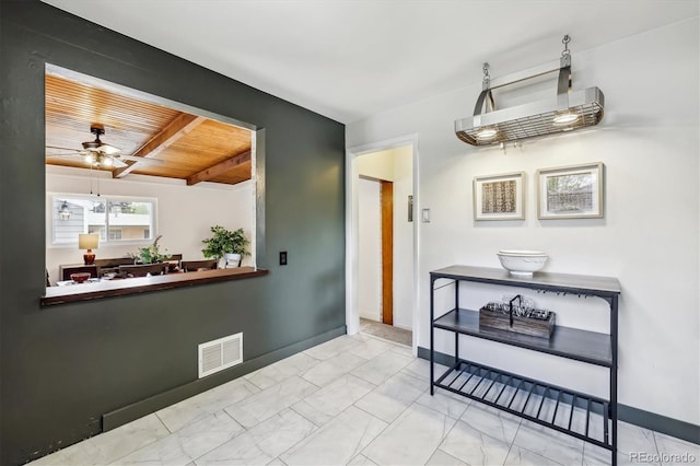 7192 W 67th Pl, Arvada, CO 80003 - dining room featuring marble finish flooring, ceiling fan, wooden ceiling, and baseboards