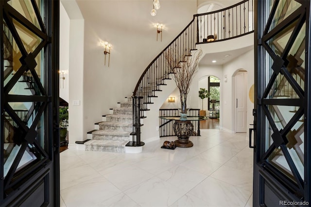 foyer with a towering ceiling