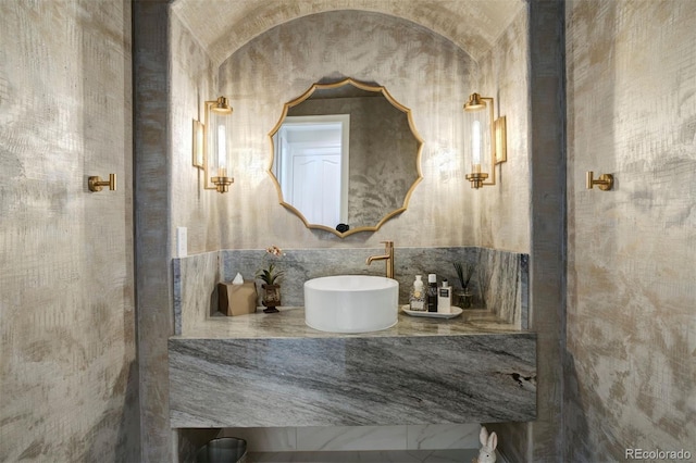 bathroom featuring tile walls and vanity