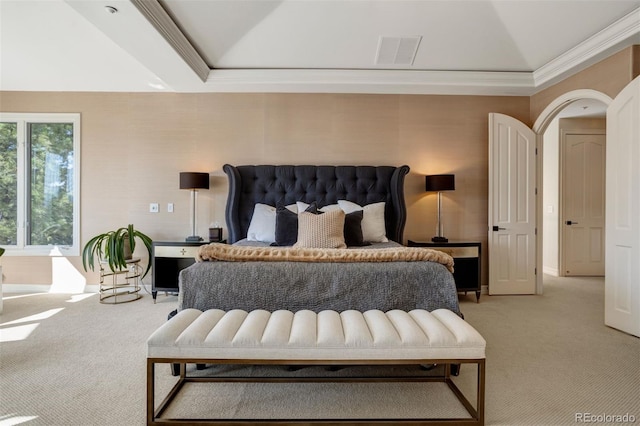 bedroom featuring light colored carpet, crown molding, and vaulted ceiling