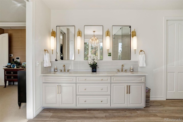 bathroom with wood-type flooring and vanity