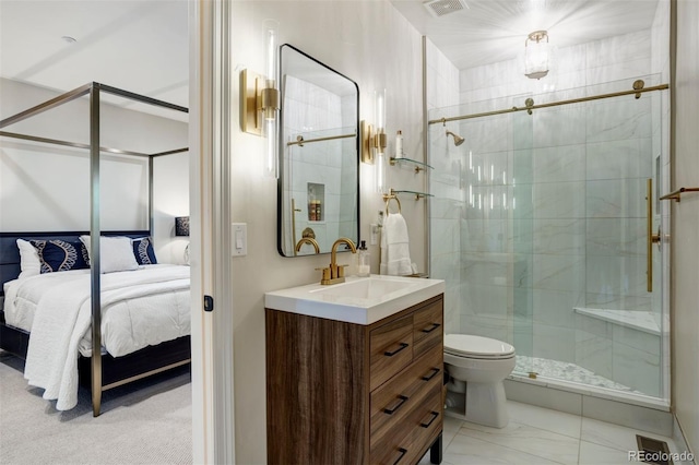 bathroom featuring vanity, toilet, and an enclosed shower